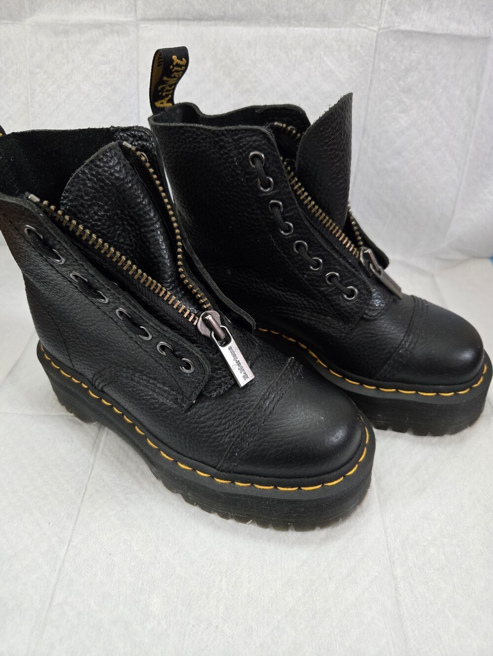 Dr. Martens Women's Black Leather 8 Eyed Combat Boots with Yellow Tag Accent